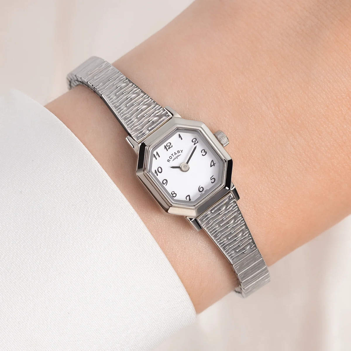 Model wears Rotary Heritage Altera Watch, Octagon Shaped White Dial with Stainless Steel Bracelet RLB10031/01