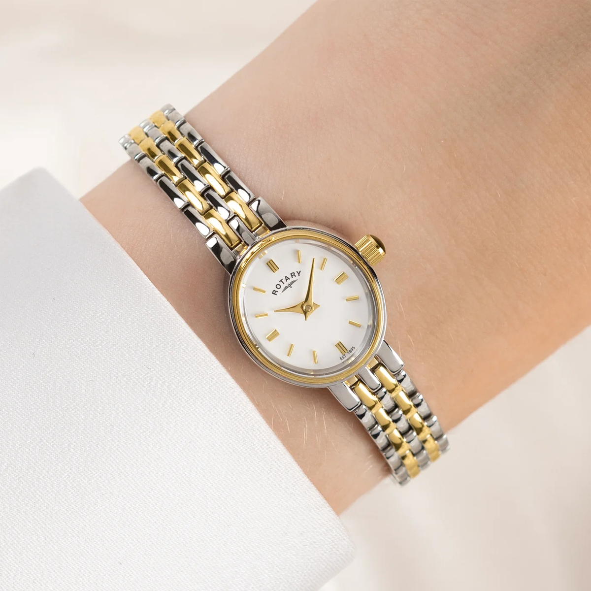 Model wears Rotary Cocktail 2-Tone, White Dial with Stainless Steel Bracelet RLB10034/02
