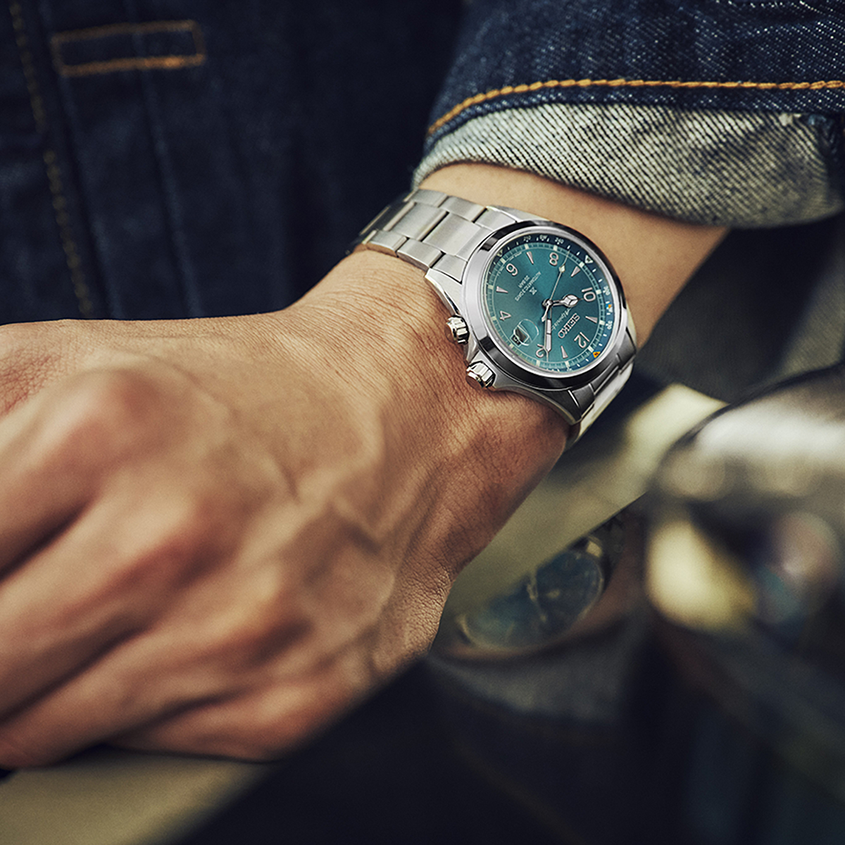 Model wears Seiko Prospex Alpinist In ‘Tealpine’, Teal Dial With Stainless Steel Bracelet  - SPB503J1