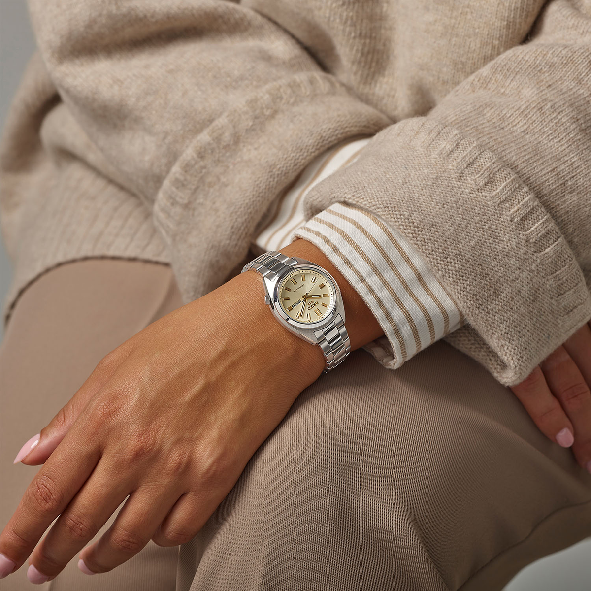 Model wears Seiko 5 Sports 'Hebitama' SNXS In Double Cream - SRE023K1
