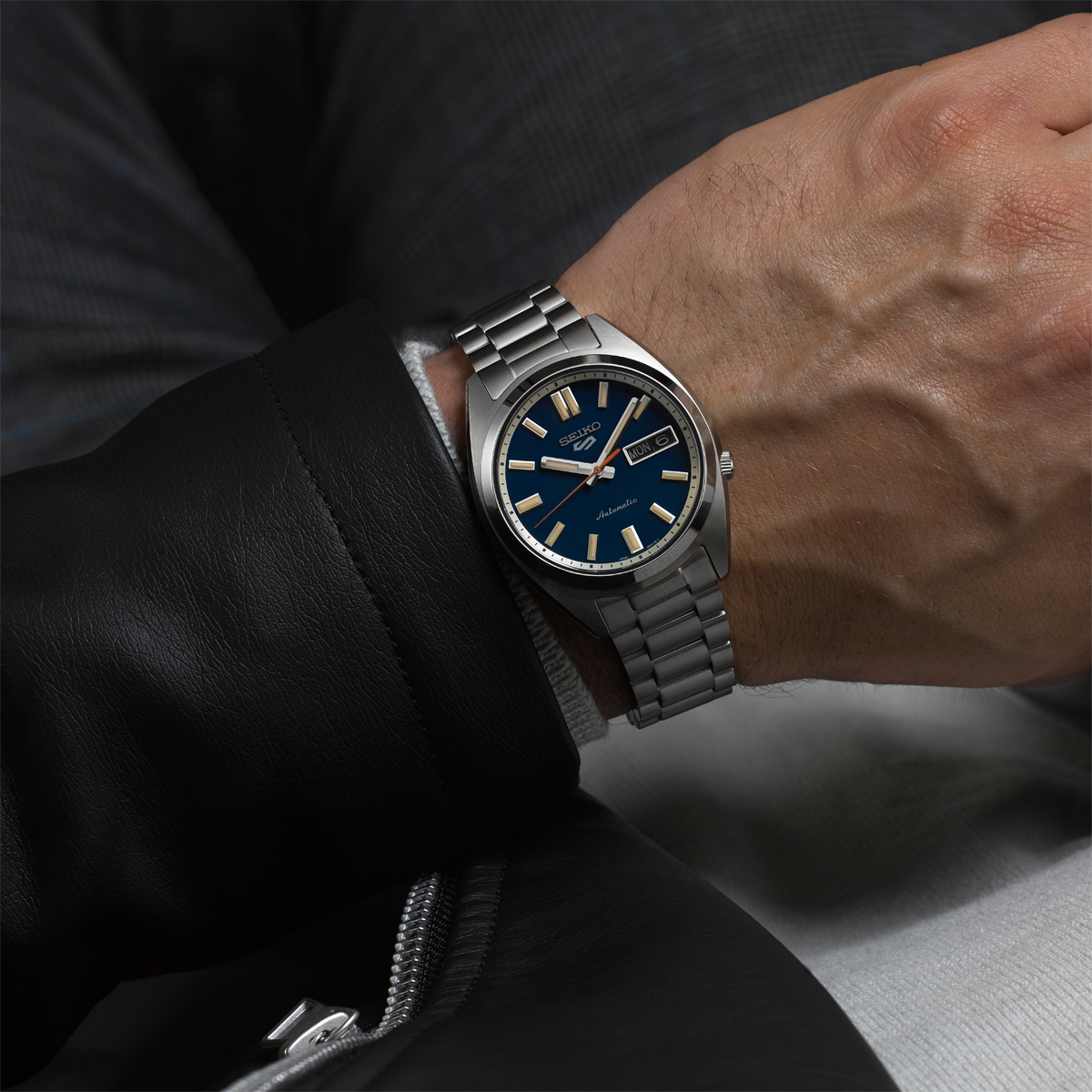 Model wears Seiko  5 Sports SNXS 'Rinse Blue' Classic Sports - SRPK87K1