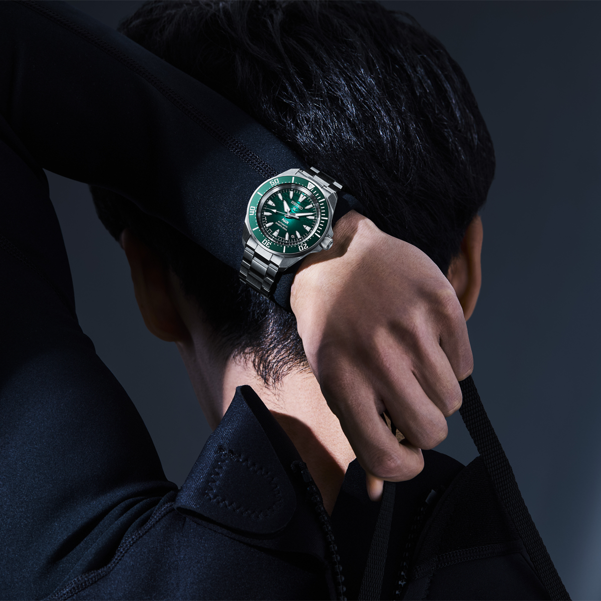Model wears Seiko Prospex PADI 60th Anniversary 4R Compact Mechanical Diver’s Watch In Underwater Green - SRPL53K1