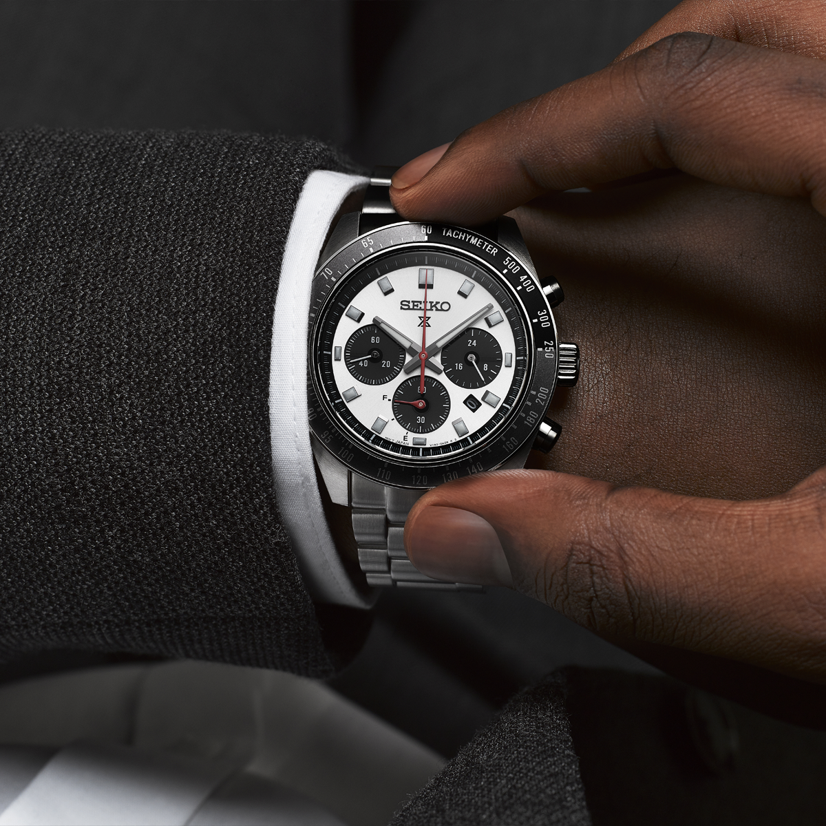 Model wears Seiko Prospex Speedtimer “Go Large” Solar Chronograph, White Dial With Stainless Steel Bracelet - SSC911P1
