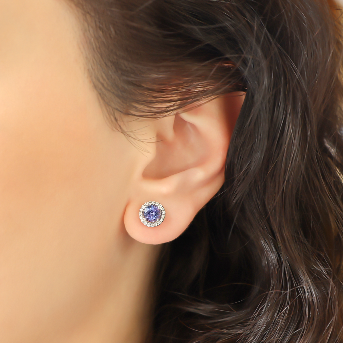 Model wears 18ct White Gold Tanzanite & Diamond Round Halo Earrings