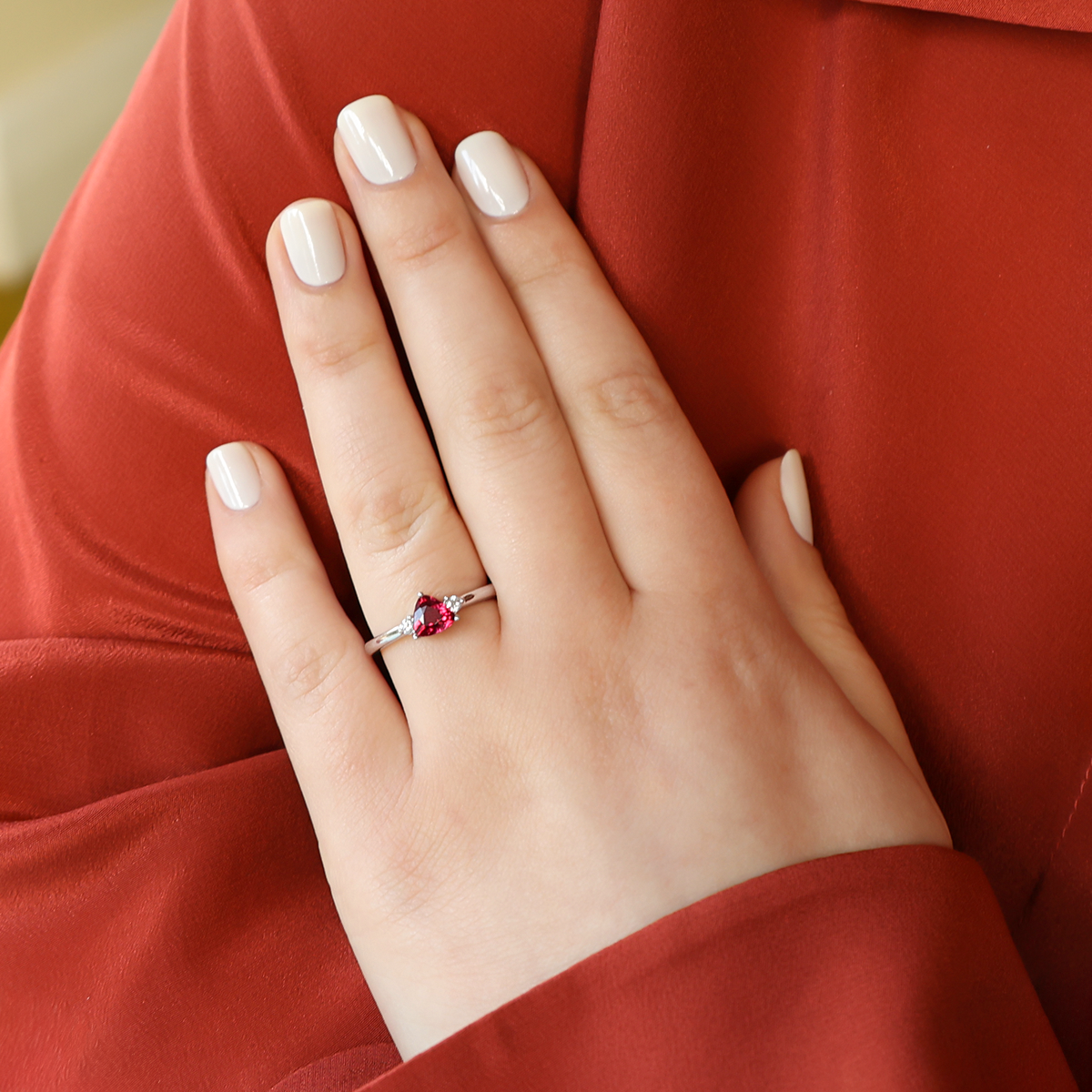 Model wears 18ct White Gold Rubellite Tourmaline & Diamond Trilogy Ring