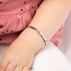 Model wears Sterling Silver White Enamel Daisy Expandable Bangle With Diamond