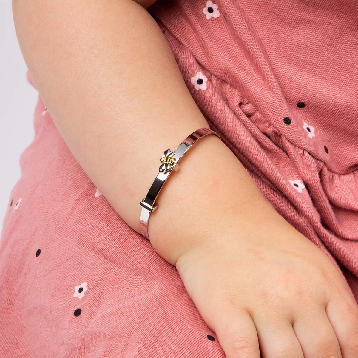 Model wears Recycled Sterling Silver Bee Expandable Bangle With Yellow Gold Plating, Enamel & Diamond