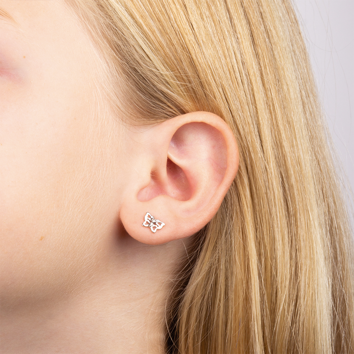 Model wears Sterling Silver Filigree Butterfly Stud Earrings With Diamond