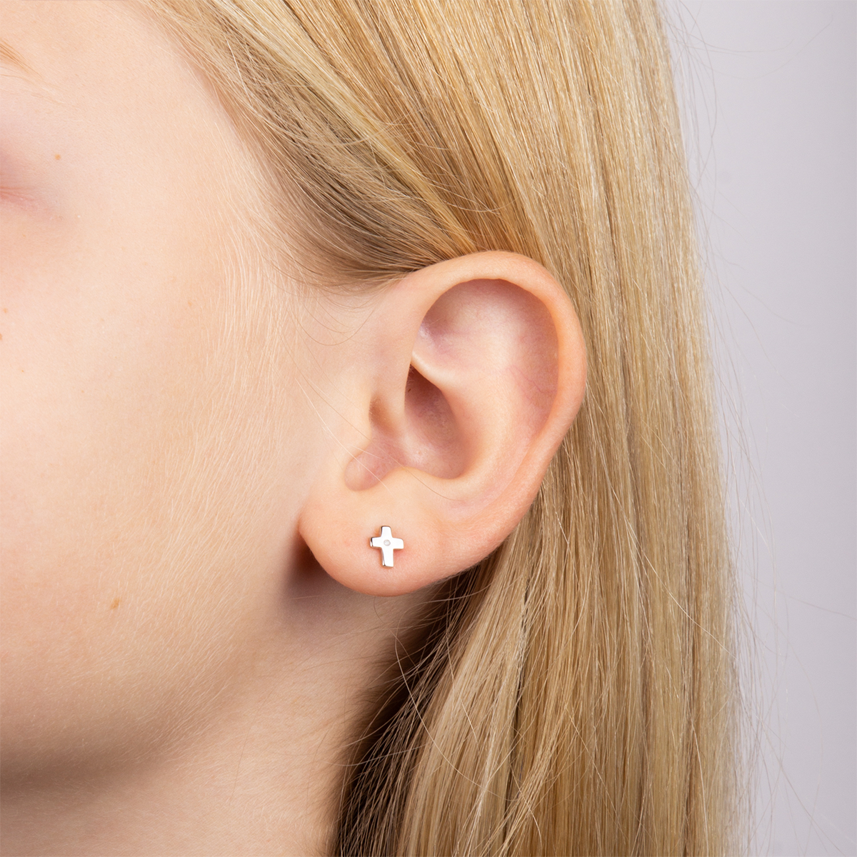 Model wears Sterling Silver Cross Stud Earrings With Diamond
