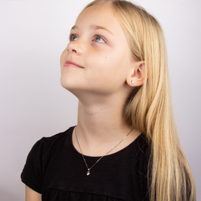 Model wears Sterling Silver Diamond Heart Earrings & Pendant With Chain