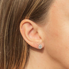 Models wears Sterling Silver Teardrop Cubic Zirconia Halo Stud Earrings