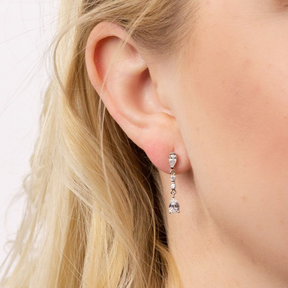 Models ear wears Sterling Silver Long Teardrop Cubic Zirconia Drop Earrings