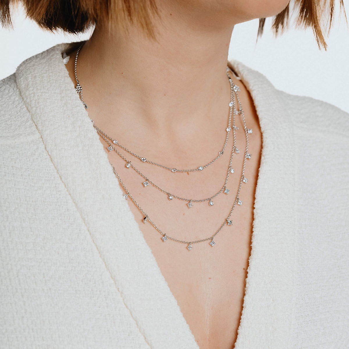Model wears Sterling Silver Triple Row Cubic Zirconia Necklace