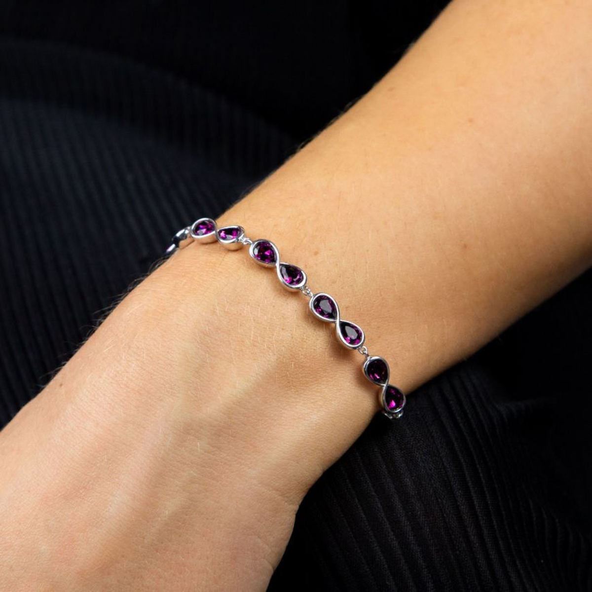 Model wears Sterling Silver Infinity Purple Crystal Bracelet