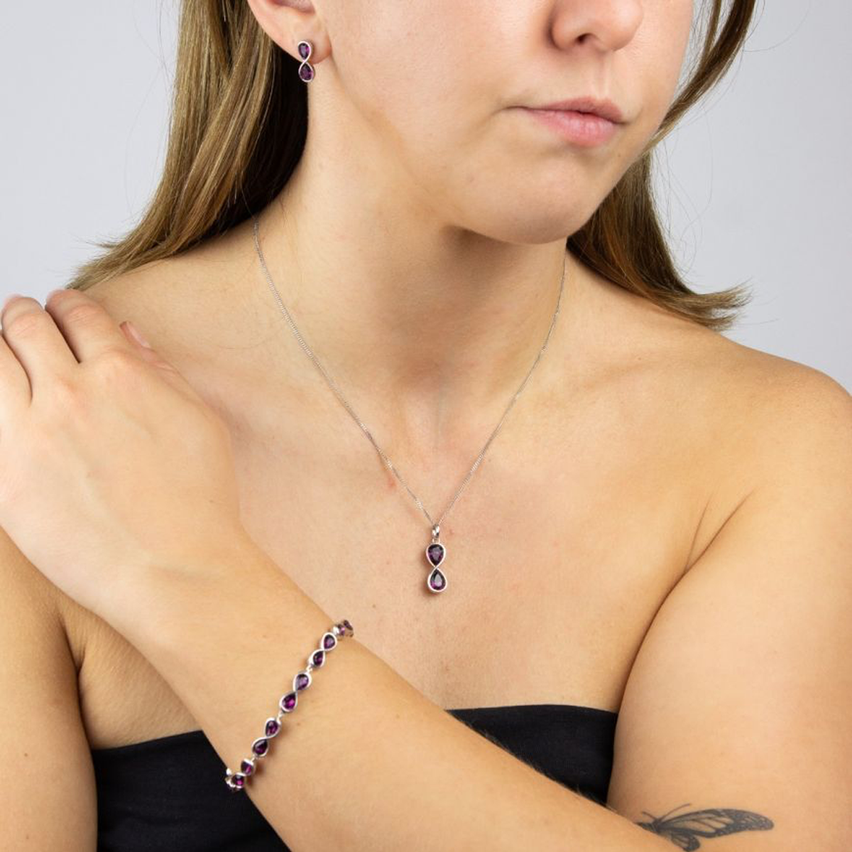 Model wears Sterling Silver Infinity Purple Crystal Set