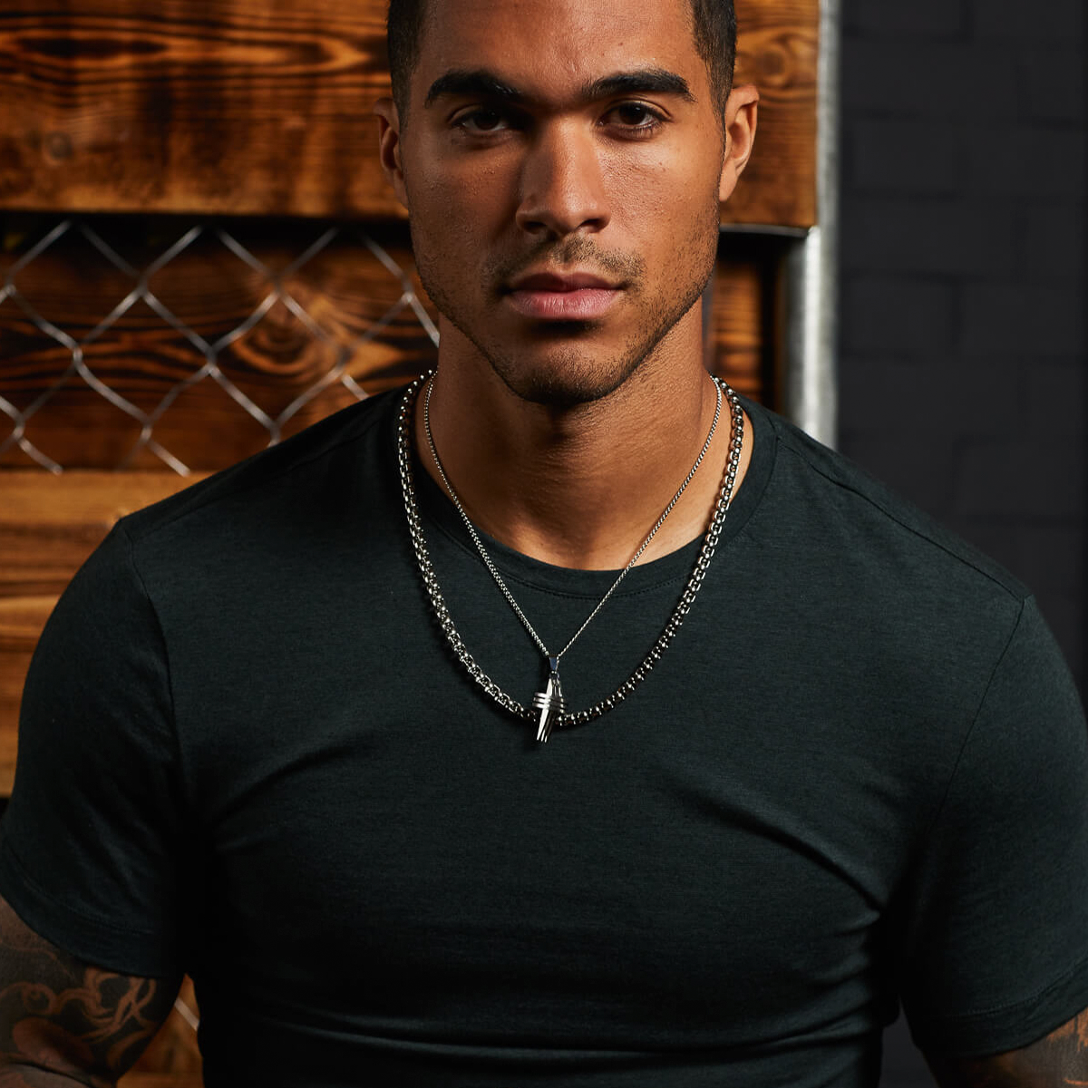 Model wears Stainless Steel Triple Cross Pendant