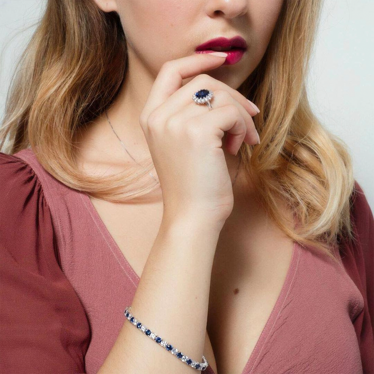 Model wearing Oval Blue Cubic Zirconia Cluster Ring